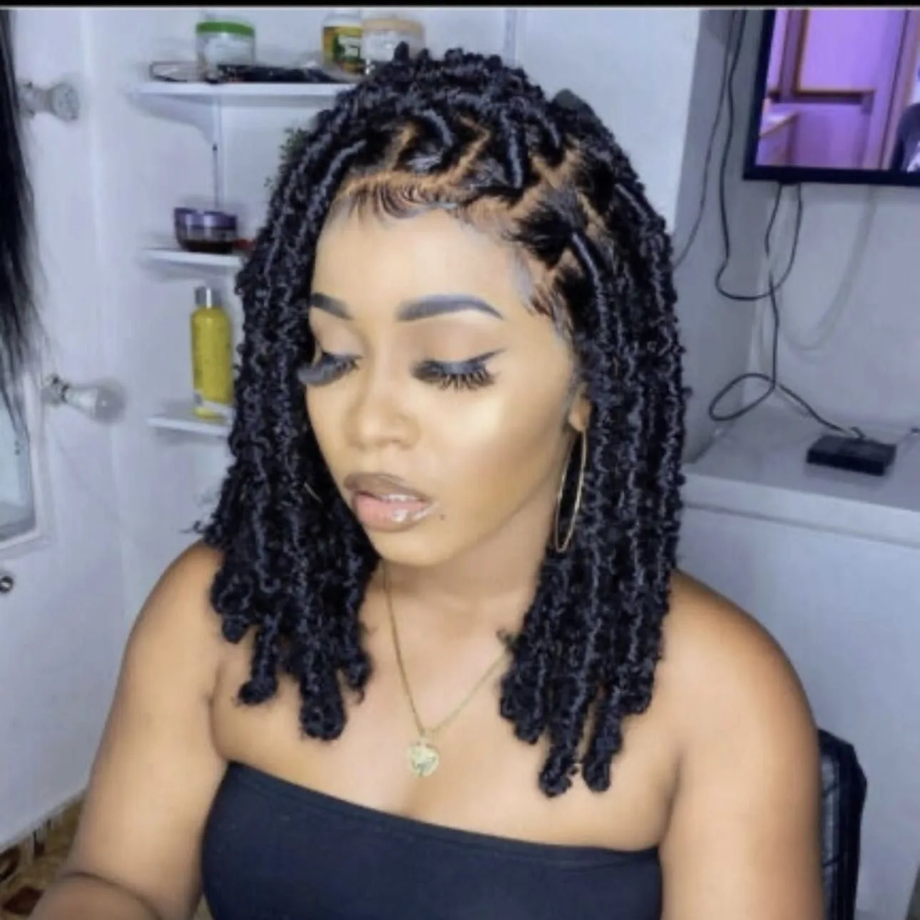 Kim's Hair Boutique client wearing butterfly locs