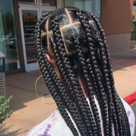 Kim's Hair Boutique client wearing large knotless braids