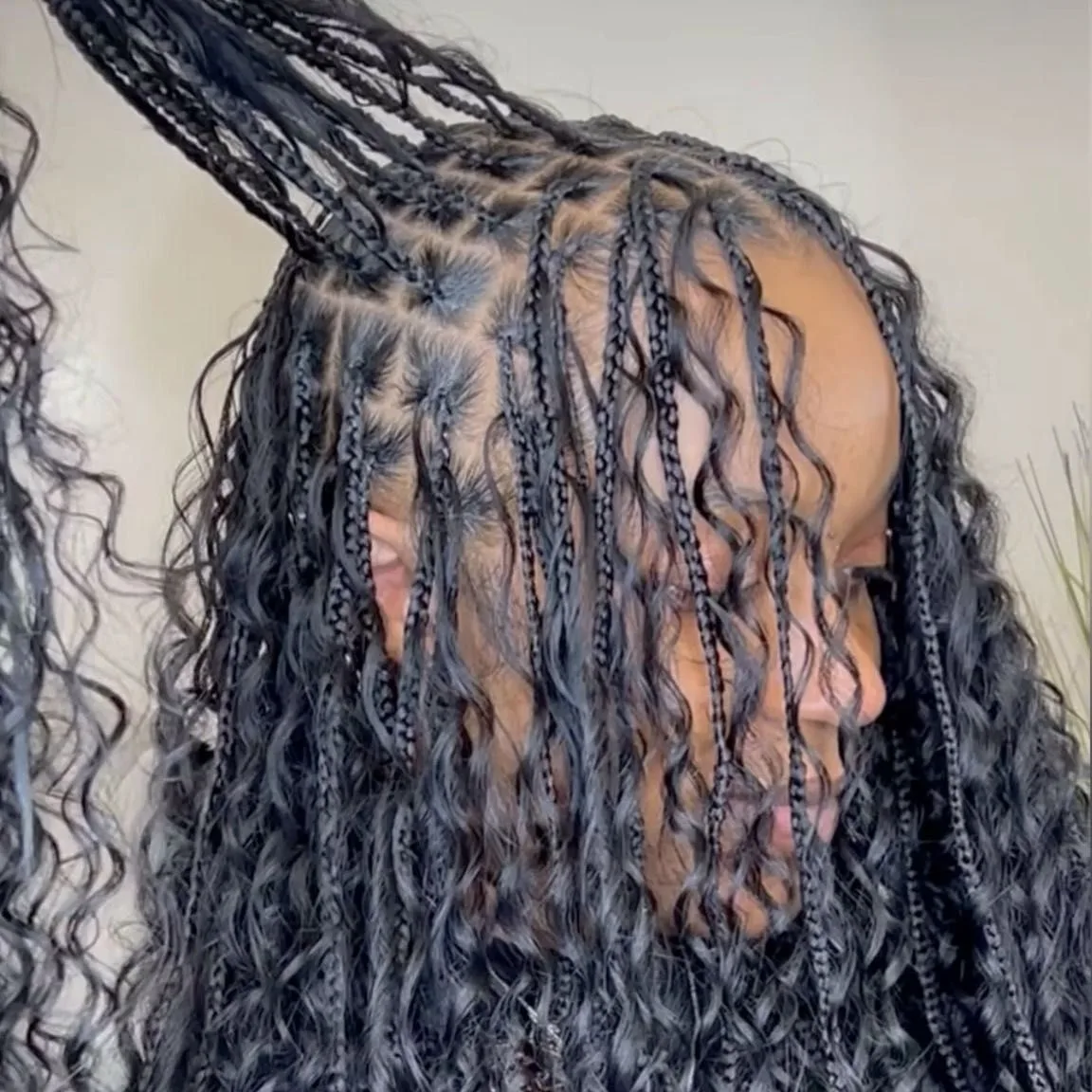 Kim's Hair Boutique client wearing medium boho knotless braids