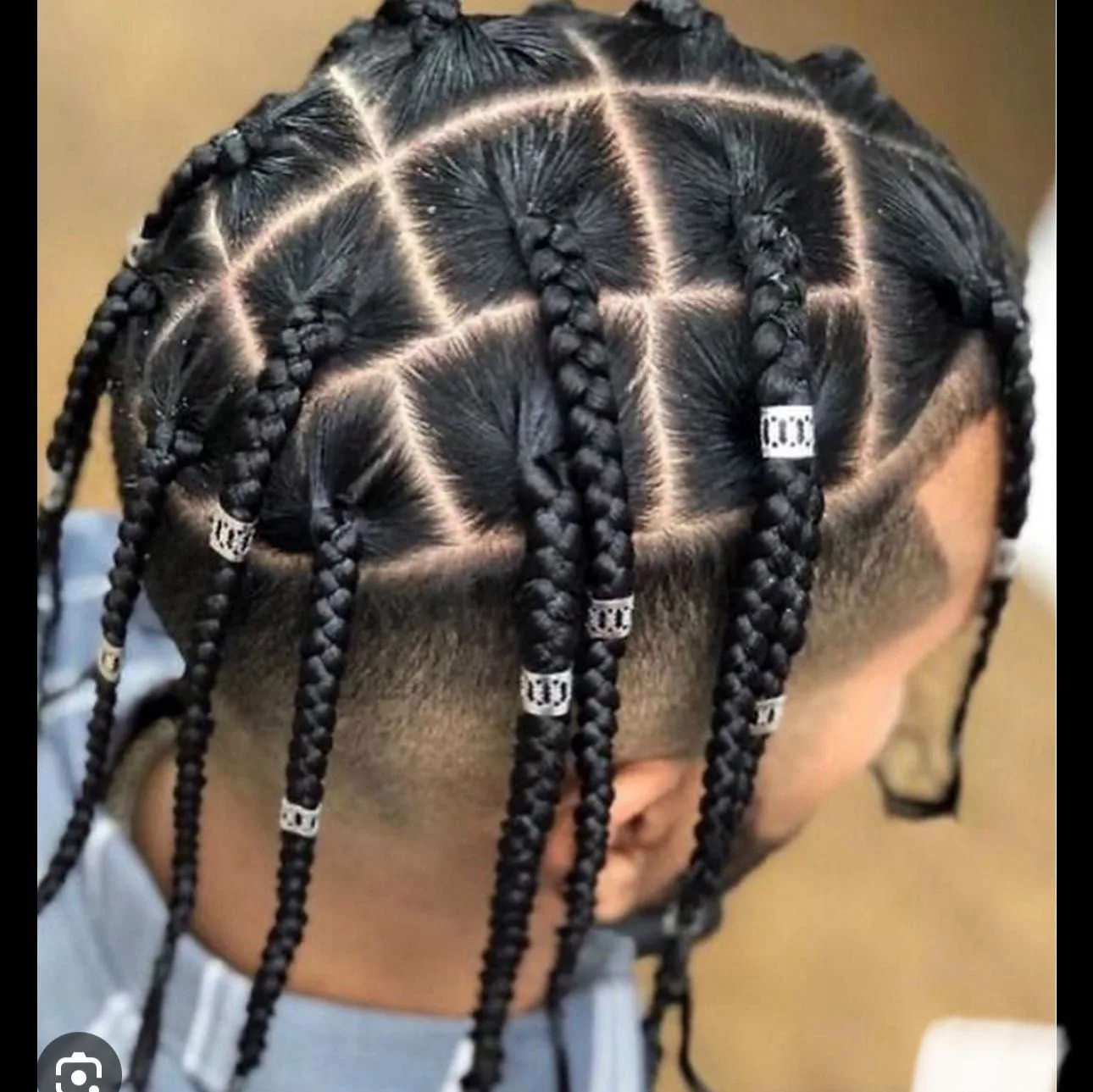 Kim's Hair Boutique client wearing individual braids