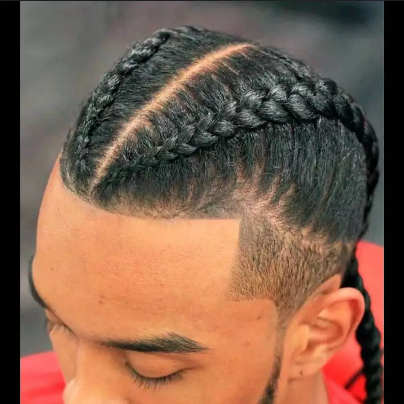 Kim's Hair Boutique client wearing two cornrows
