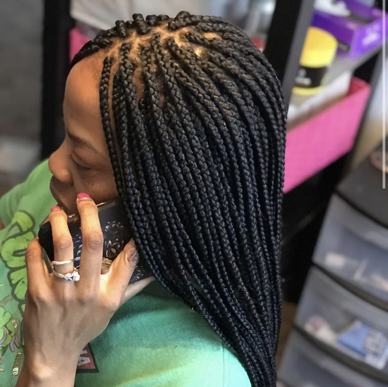 Kim's Hair Boutique client wearing small individual braids