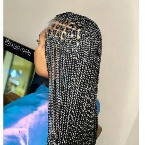 Kim's Hair Boutique client wearing small knotless braids