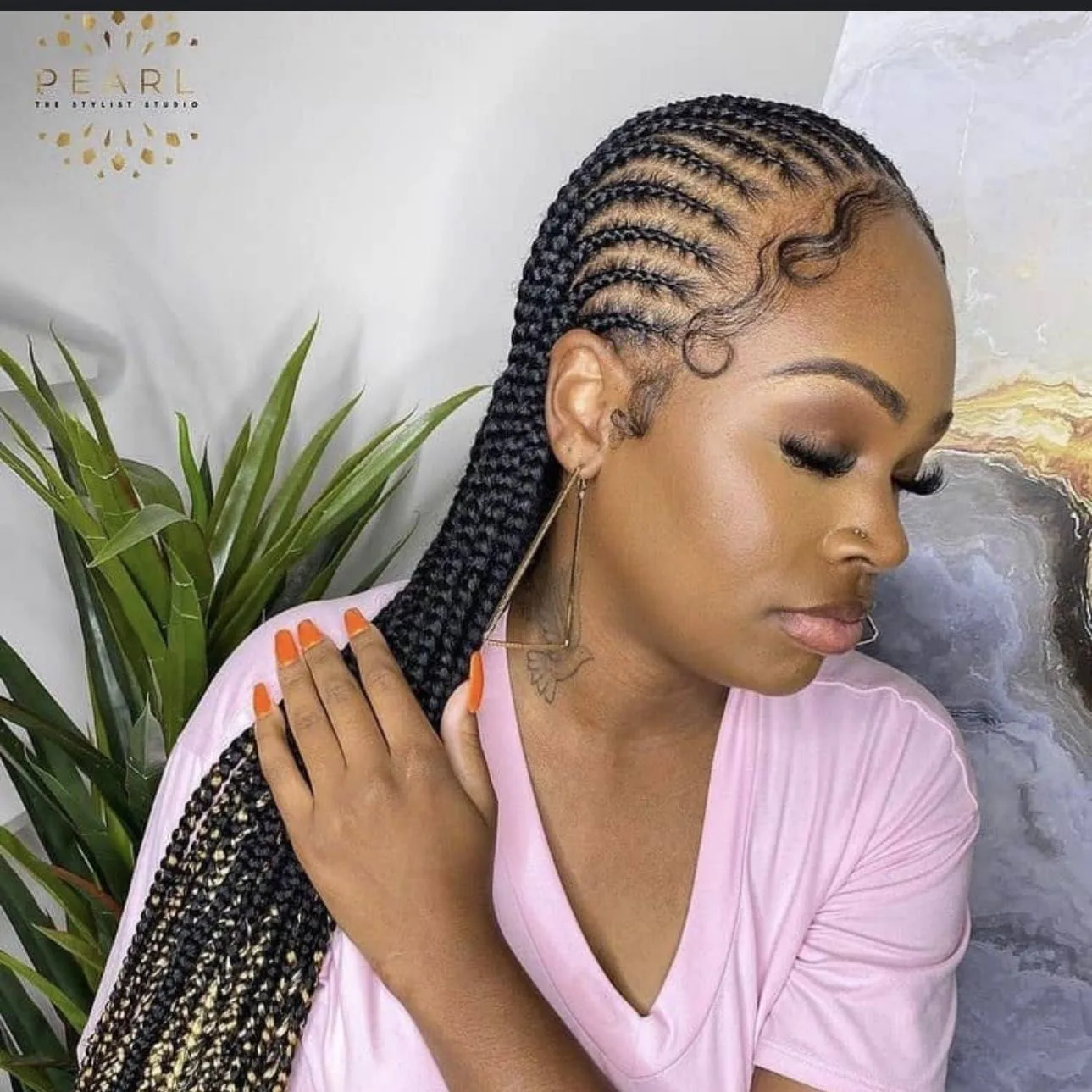 Kim's Hair Boutique client wearing straight-back feed-in braids