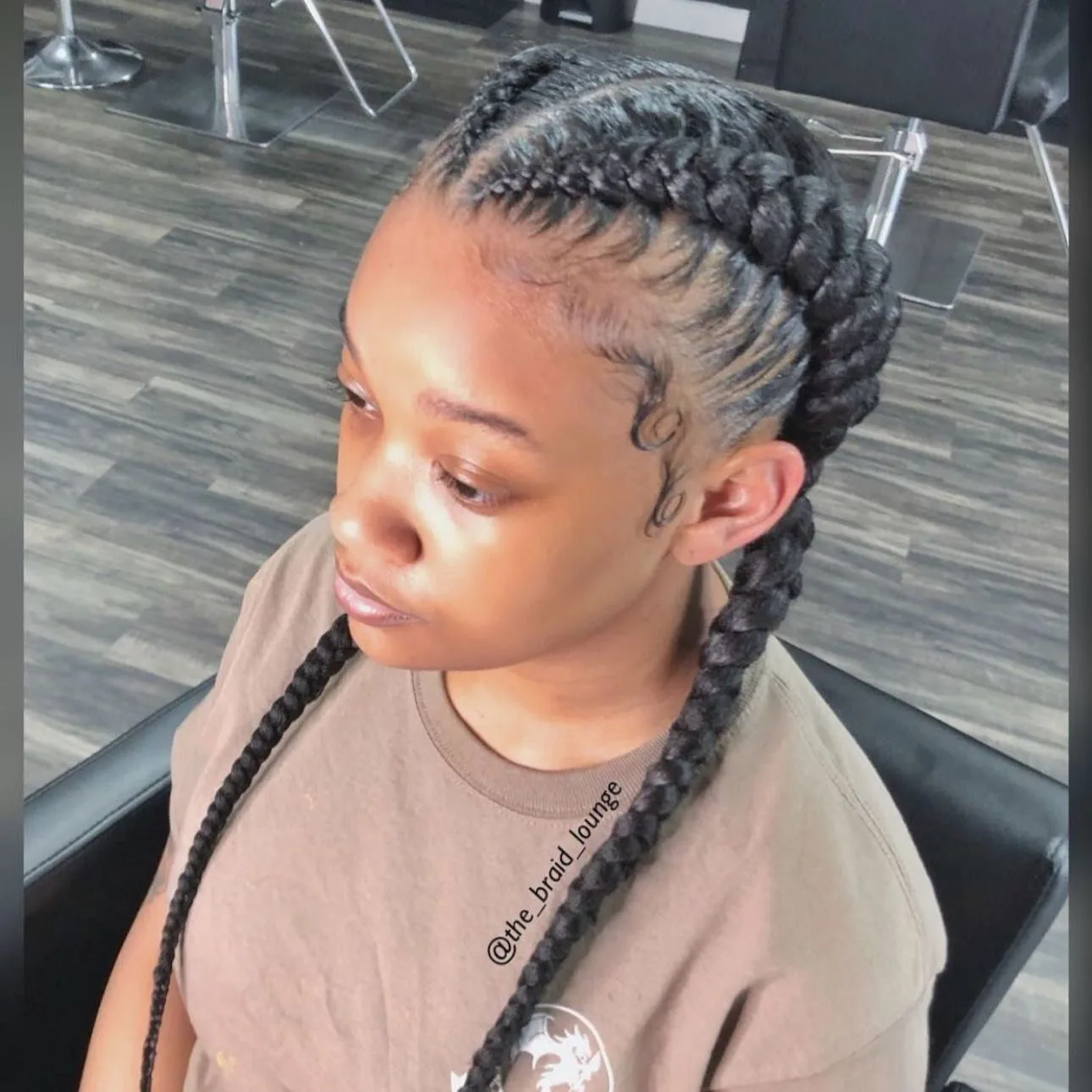 Kim's Hair Boutique client wearing two cornrows