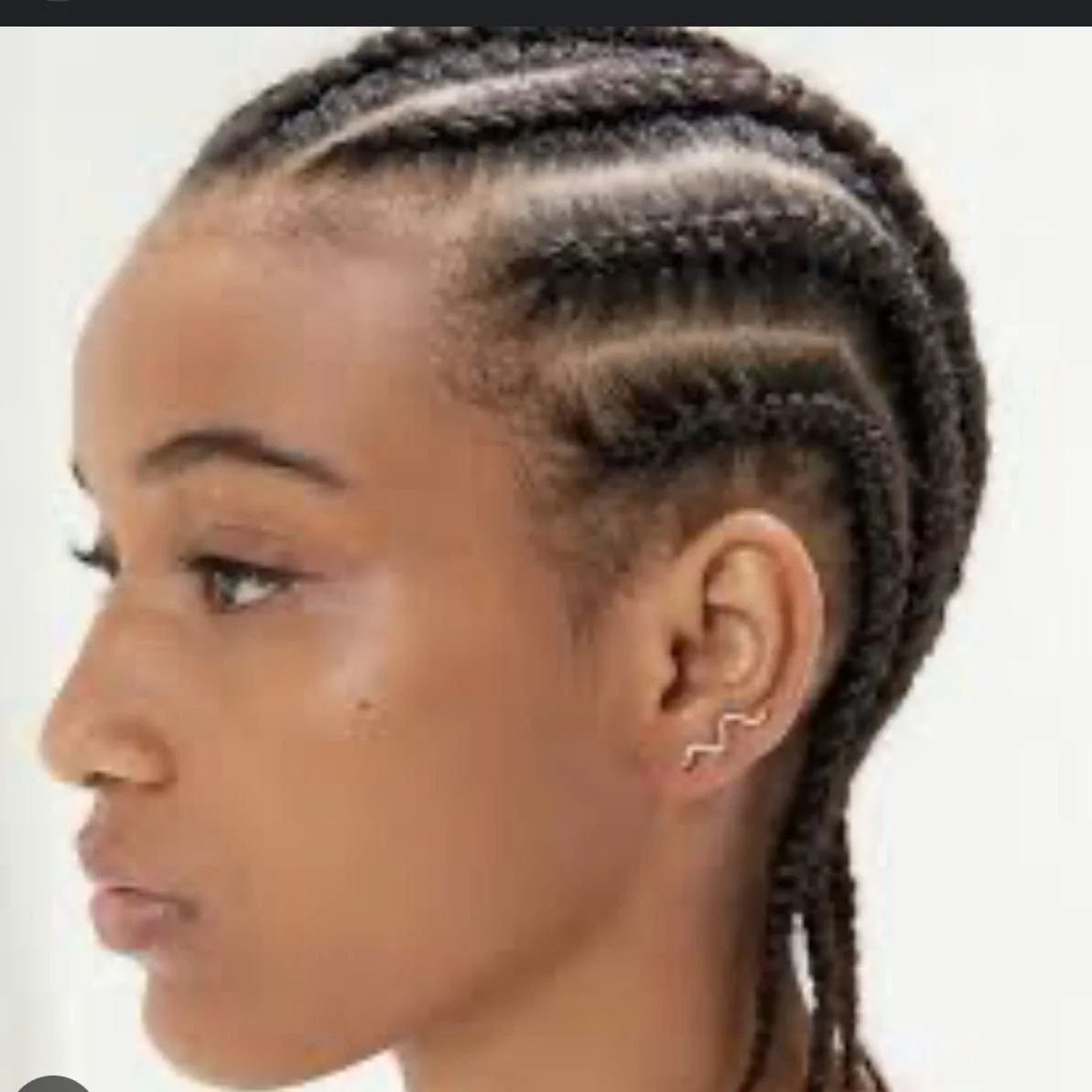 Kim's Hair Boutique client wearing natural straight-back cornrows