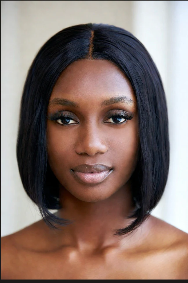 Model wearing a sleek, shoulder-length black bob wig